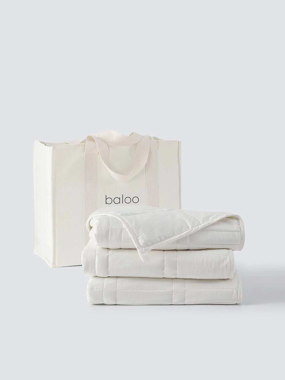 Weighted Throw — Pebble White,12 lb · fotografía oficial Baloo Living
